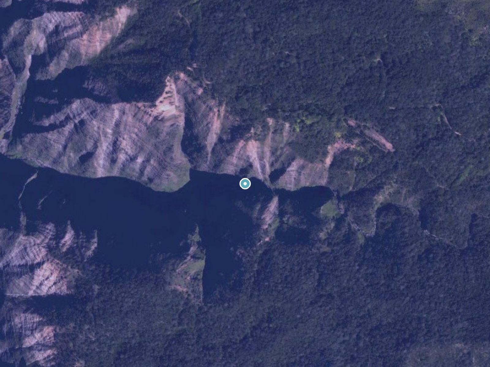 Aerial view of the ground around Mōhihi Falls near Wainiha, Hawaii