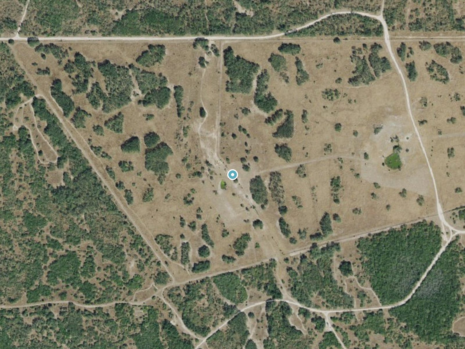 Aerial photo of the same ground around Tecolote Artesian Well near San Perlita, Texas, for comparison with the lidar view