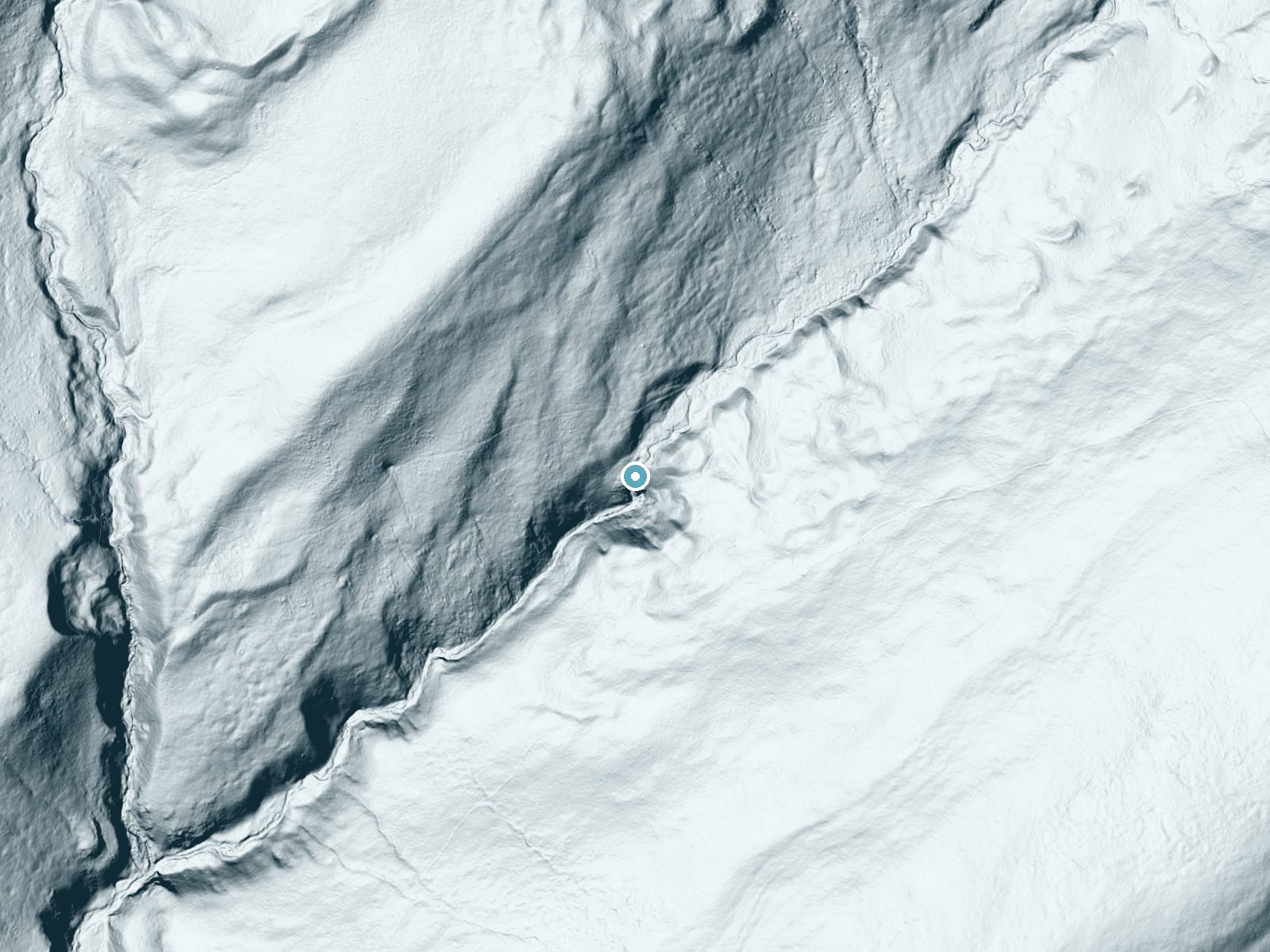LiDAR bare-earth terrain around Pecos Falls near Mora, New Mexico, showing about 141 feet of drop, a steep tiered drop, facing south