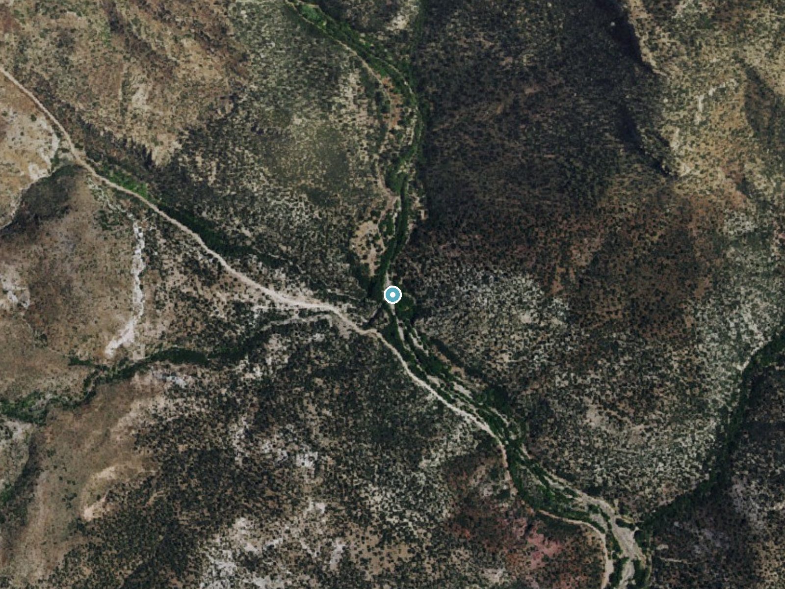 Aerial view of the ground around Water and Ice Falls near Enterprise, Nevada