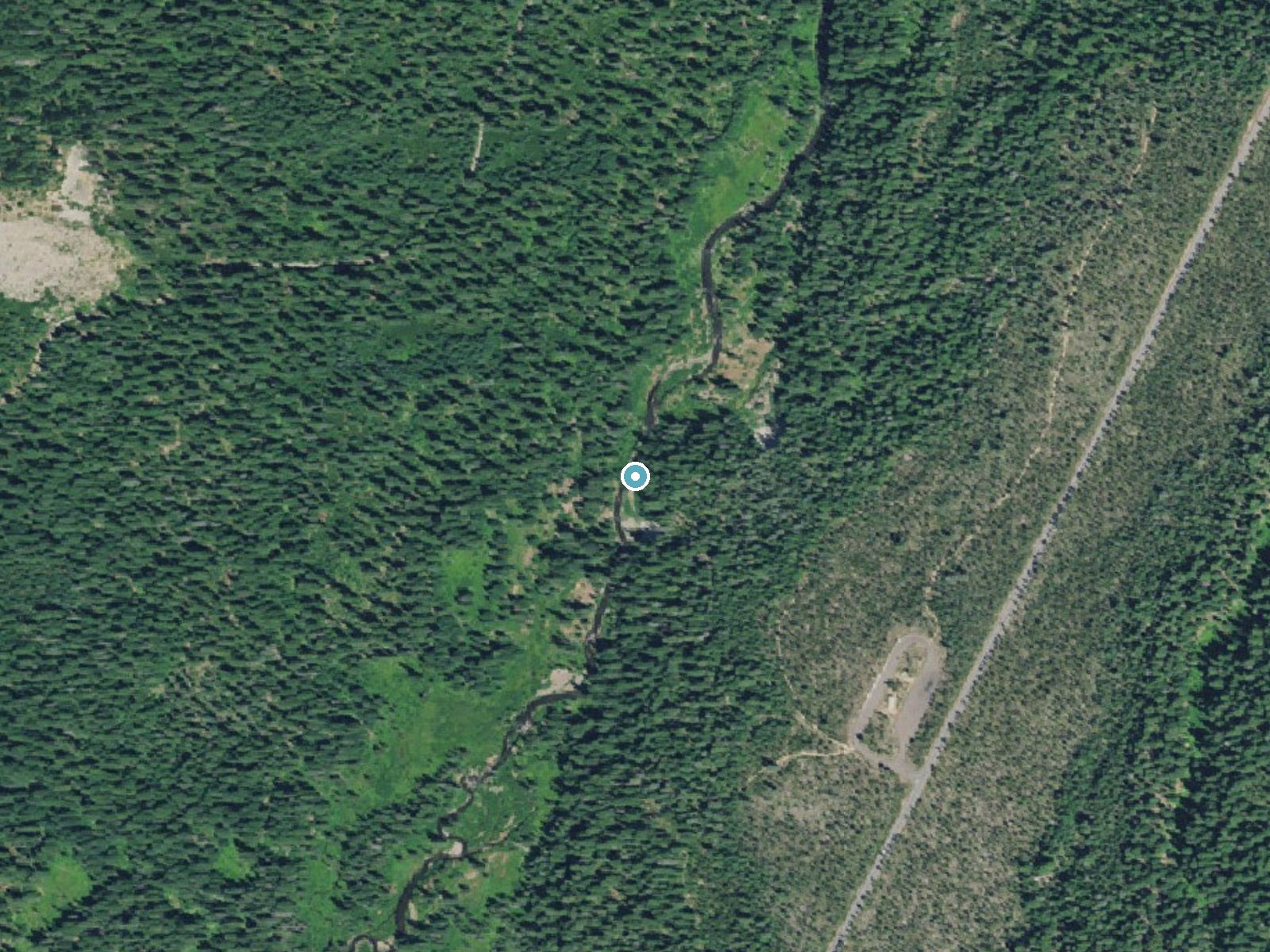 Aerial view of the ground around Muir Creek Falls near Prospect, Oregon