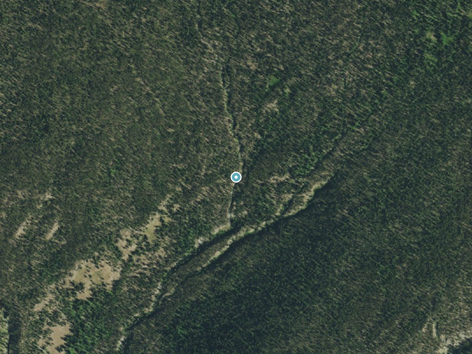 Aerial photo of the same ground around Quiver Cascade near West Yellowstone, Wyoming, for comparison with the lidar view