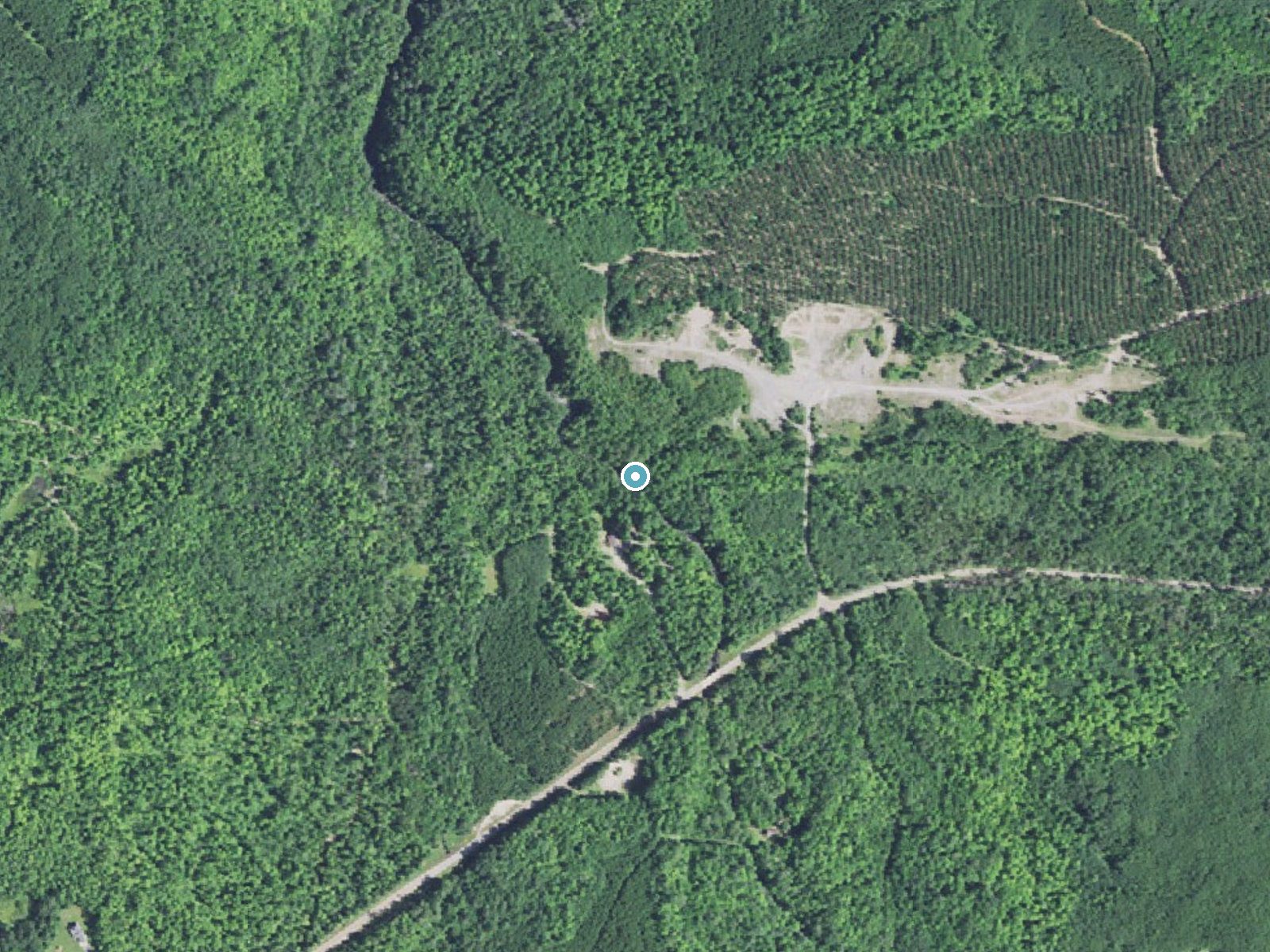 Aerial view of the ground around Middle Silver River Falls near L'Anse, Michigan