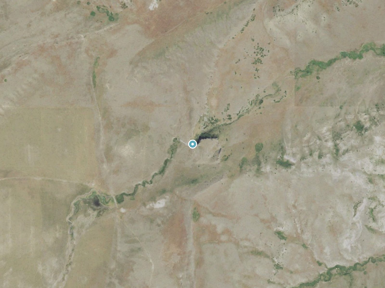 Aerial view of the ground around Buffalo Falls near Cascade Colony, Montana