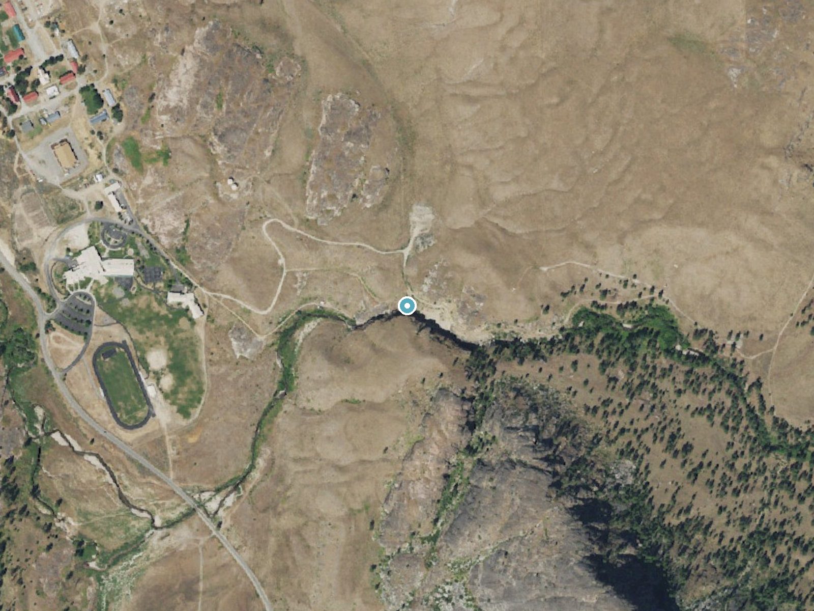 Aerial view of the ground around Mission Falls near North Omak, Washington