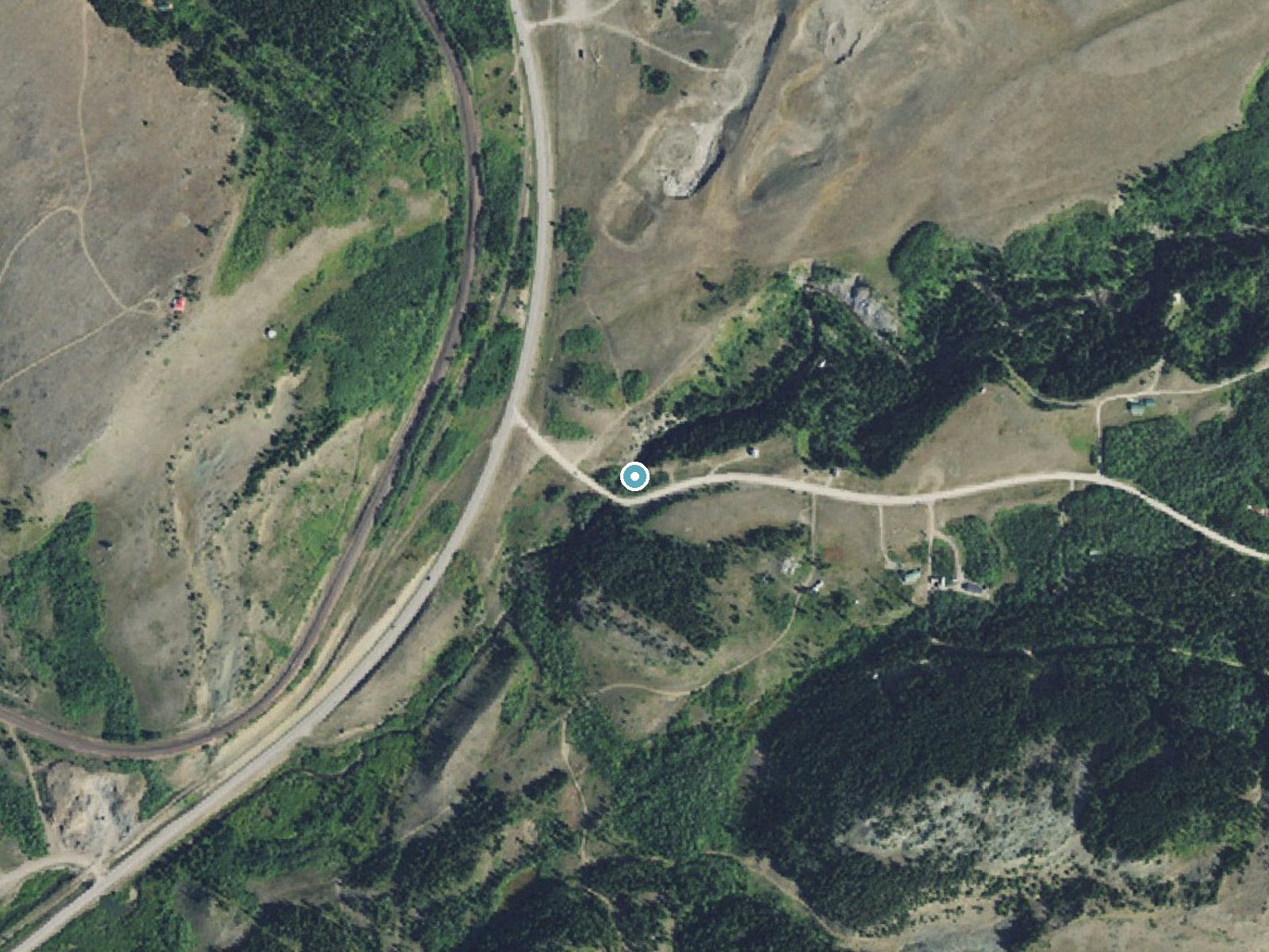 Aerial photo of the same ground around Dawson Falls near East Glacier Park Village, Montana, for comparison with the lidar view