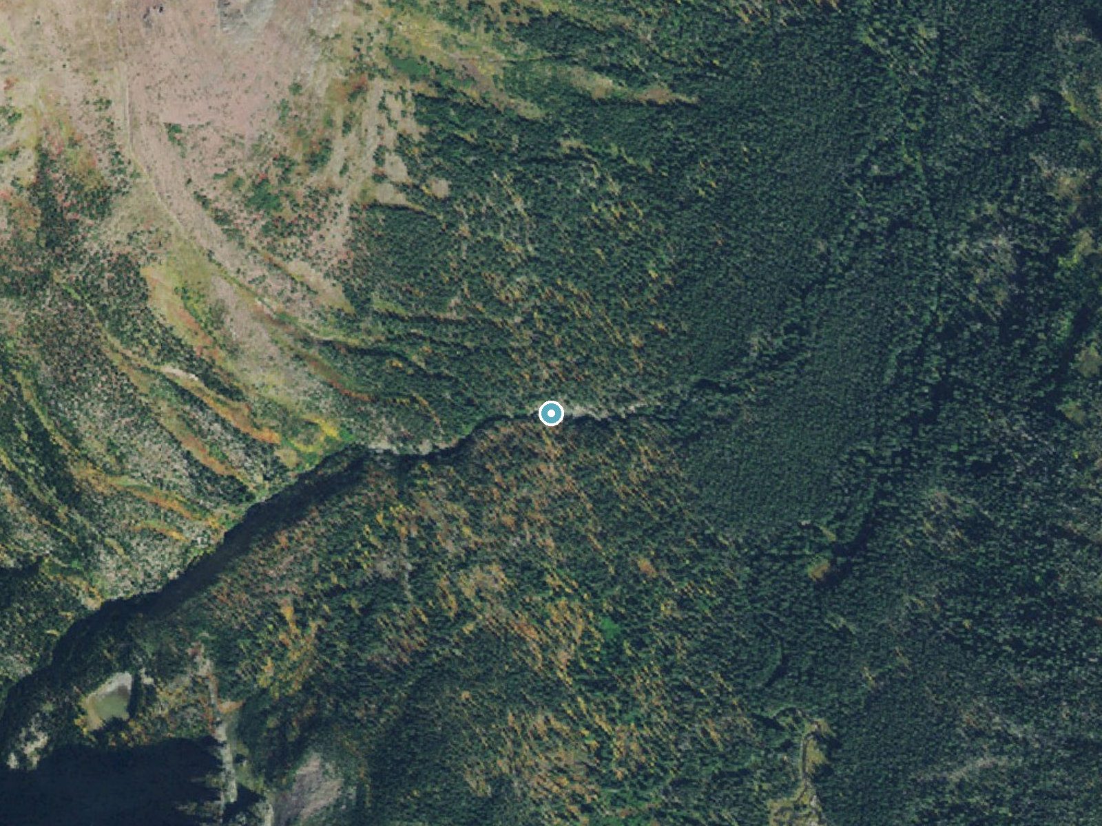 Aerial photo of the same ground around Rockwell Falls near East Glacier Park Village, Montana, for comparison with the lidar view