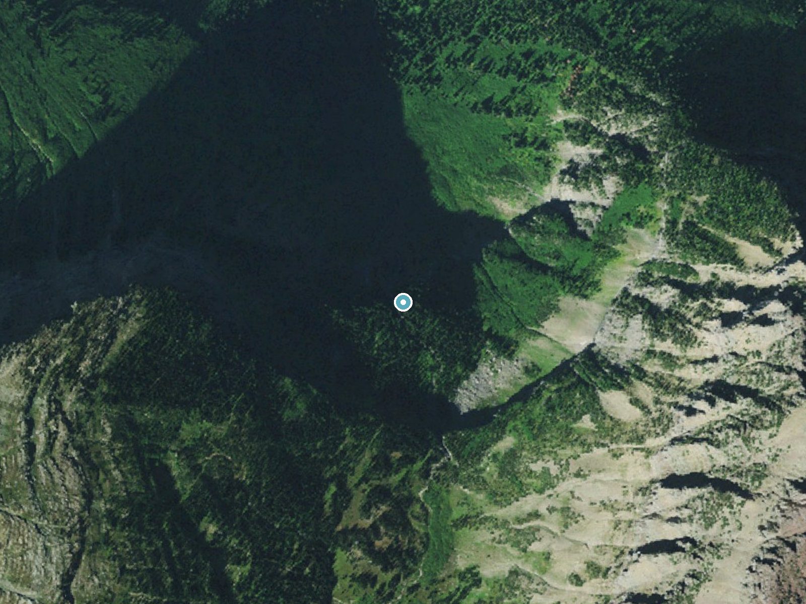 Aerial photo of the same ground around Bird Woman Falls near Saint Mary, Montana, for comparison with the lidar view