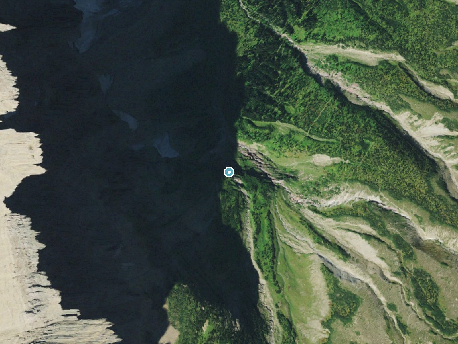 Aerial photo of the same ground around Morning Eagle Falls near Saint Mary, Montana, for comparison with the lidar view
